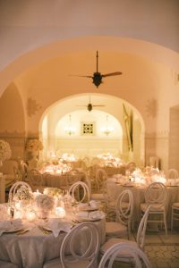 Table set-up for Midsummer Night's Eve-themed white welcome party at this Positano wedding weekend in Villa Tre Ville | Photo by Gianni di Natale