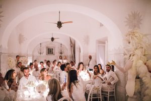 White feather surprise at the Midsummer Night's Eve-themed white welcome party at this Positano wedding weekend in Villa Tre Ville | Photo by Gianni di Natale