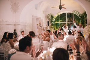 Guests at the Midsummer Night's Eve-themed white welcome party at this Positano wedding weekend in Villa Tre Ville | Photo by Gianni di Natale