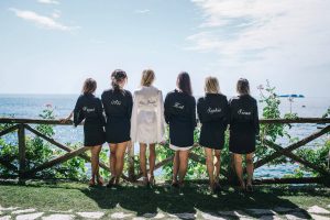 Bride and bridesmaids in robes at this Positano wedding weekend in Villa Tre Ville | Photo by Gianni di Natale