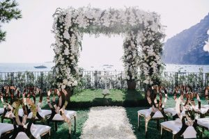 Floral arch during ceremony at this Positano wedding weekend in Villa Tre Ville | Photo by Gianni di Natale