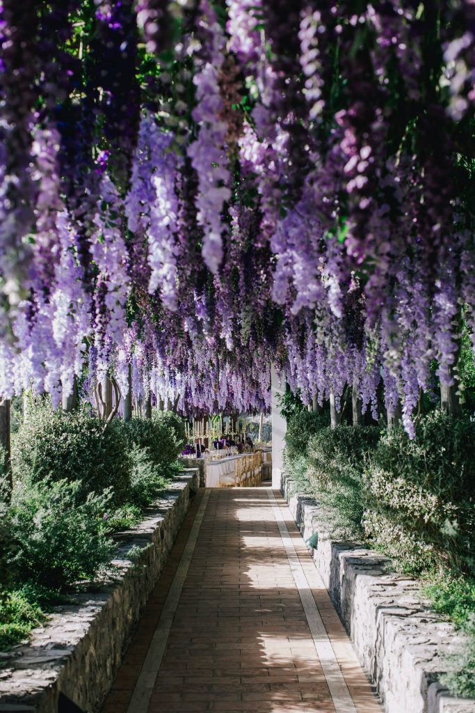 Hanging purple flowers at this Positano wedding weekend in Villa Tre Ville | Photo by Gianni di Natale