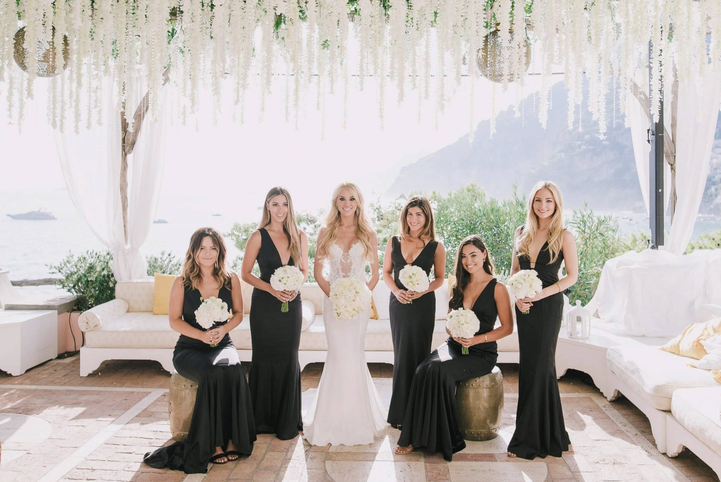 Bride with bridesmaids in black at this Positano wedding weekend in Villa Tre Ville | Photo by Gianni di Natale
