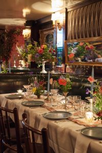 Table and floral decor at this 40th surprise birthday party at Beatrice Inn in West Village | Photo by Darren Ornitz