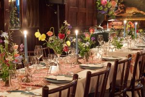 Warmly decorated tablescape at this 40th surprise birthday party at Beatrice Inn in West Village | Photo by Darren Ornitz