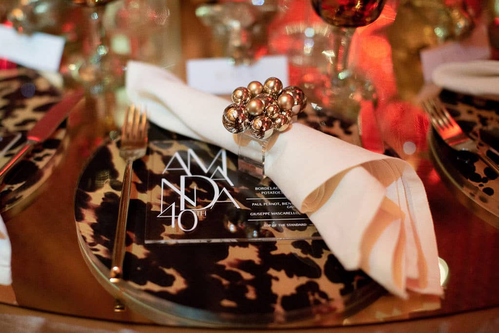 Table setting at this 40th surprise birthday at the Boom Boom Room in NYC | Photo by Luis Zepeda