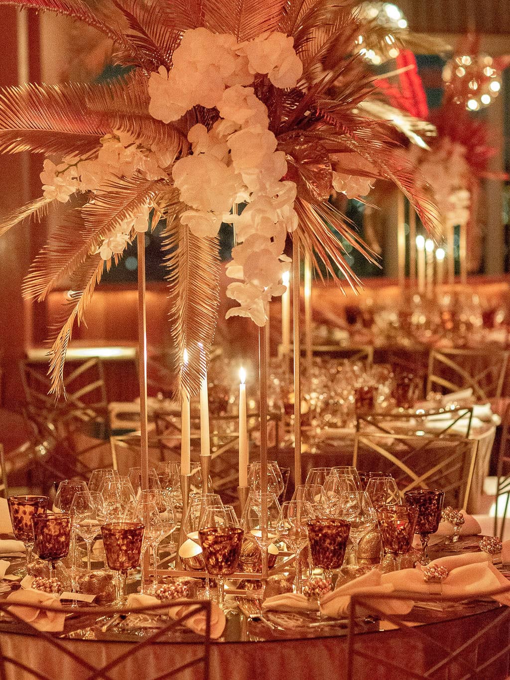 Gold and red table decor at this 40th surprise birthday at the Boom Boom Room in NYC | Photo by Luis Zepeda