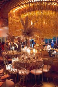 Glamorous gold decor at this 40th surprise birthday at the Boom Boom Room in NYC | Photo by Luis Zepeda