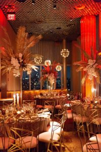 Red and gold glamorous decor at this 40th surprise birthday at the Boom Boom Room in NYC | Photo by Luis Zepeda