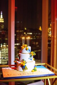 3-tier Capri-inspired birthday cake with lemon details at this 40th surprise birthday at the Boom Boom Room in NYC | Photo by Luis Zepeda