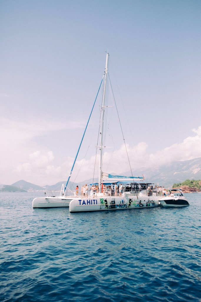 Catamaran sail at this Aman Sveti Stefan Montenegro destination wedding weekend | Photo by Allan Zepeda