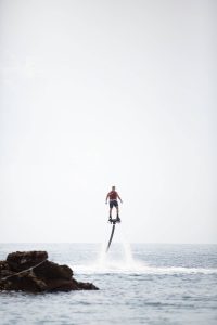 Water flyboard from private beach at this Aman Sveti Stefan Montenegro destination wedding weekend | Photo by Allan Zepeda