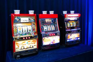Slot machines at Casino Royale-themed party at this Aman Sveti Stefan Montenegro destination wedding weekend | Photo by Allan Zepeda