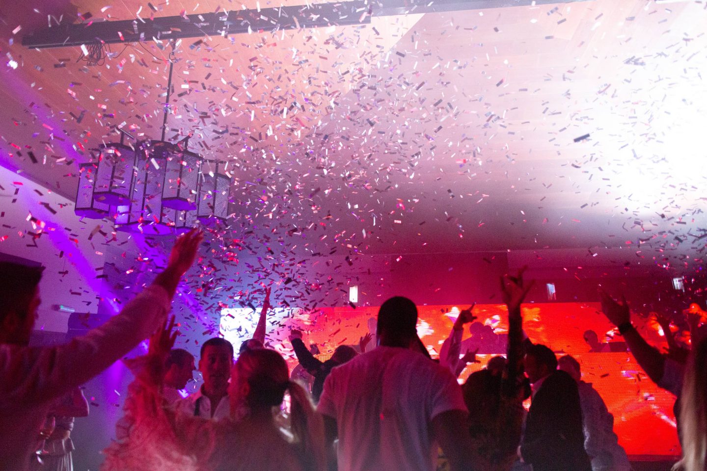 After party confetti and dancing at this Aman Sveti Stefan Montenegro destination wedding weekend | Photo by Allan Zepeda