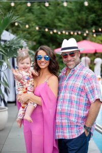 Parents and baby at this South Beach-inspired first birthday pool party in the Hamptons | Photo by Cava Photo