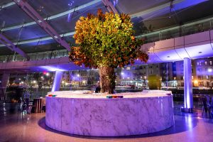 Giant floral design at drink station at this Brooklyn Museum rehearsal dinner in NYC | Photo by Gruber Photo