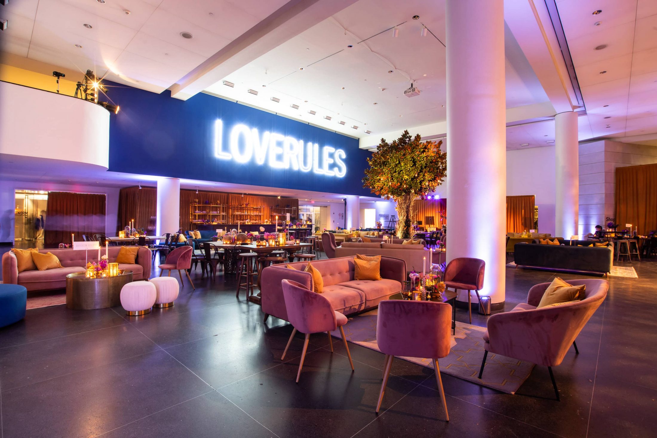 Love Rules sign overlooking lounge area at this Brooklyn Museum rehearsal dinner in NYC | Photo by Gruber Photo