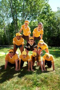 Yellow team pyramid at field day at this camp-themed wedding weekend at Cedar Lakes Estate in Upstate NY, USA | Photo by Christian Oth Studios