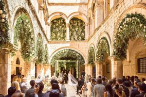 Bride and groom at ceremony decorated with peonies, jasmine, and tuberose by Theirry Boutemy at Palača Sponza at this Dubrovnik Wedding in Croatia | Photo by Robert Fairer