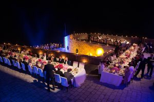 Guests during evening dinner party at Fort Lovrijenac at this Dubrovnik wedding in Croatia | Photo by Robert Fairer