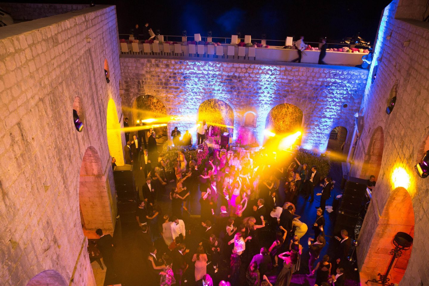 Evening dinner party dancing at Fort Lovrijenac at this Dubrovnik wedding in Croatia | Photo by Robert Fairer