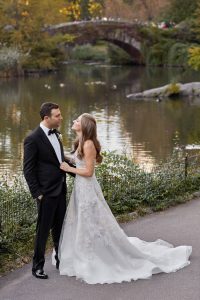 Bride and groom at central park at this classic autumn wedding at The Plaza in NYC | Photo by Christian Oth Studio