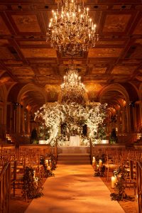 Ceremony with gorgeous floral chuppah designed by Ed Libby at this classic autumn wedding at The Plaza in NYC | Photo by Christian Oth Studio
