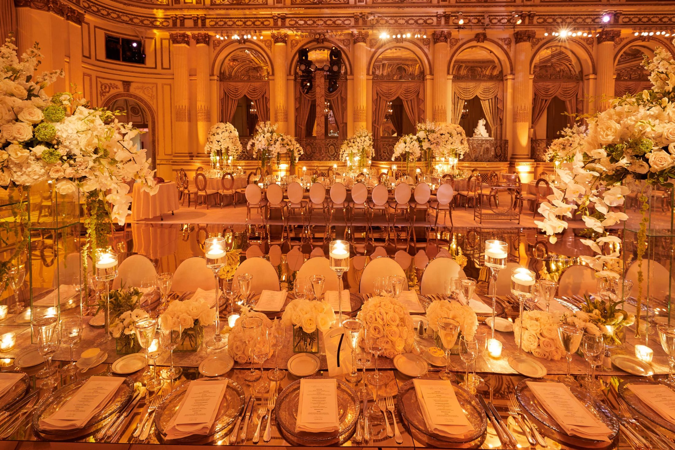 Stunning gilded reception area with a mercury glass floor and mirrored tables at this classic autumn wedding at The Plaza in NYC | Photo by Christian Oth Studio