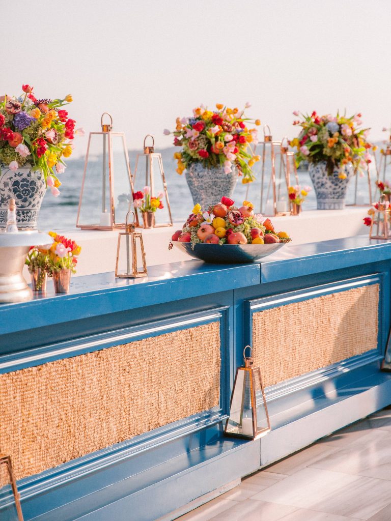 Floral decor at bright and colorful welcome party at this Istanbul wedding weekend at Four Seasons Bosphorus | Photo by Allan Zepeda