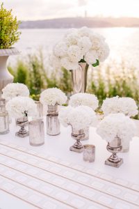 White party floral table decor at this Istanbul wedding weekend at Four Seasons Bosphorus | Photo by Allan Zepeda