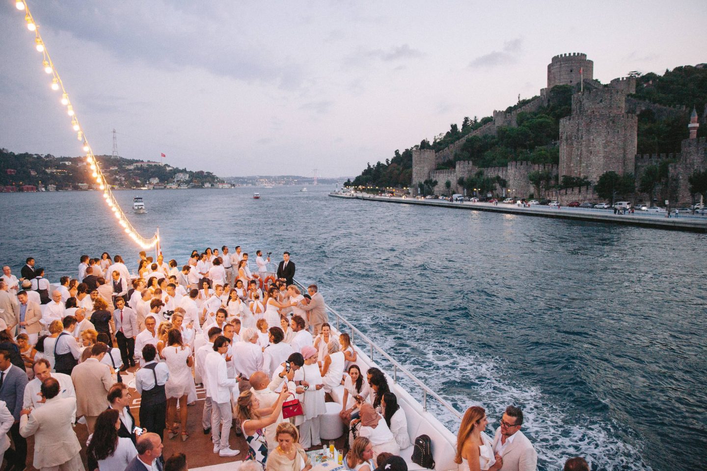 Guests during white party at this Istanbul wedding weekend at Four Seasons Bosphorus | Photo by Allan Zepeda