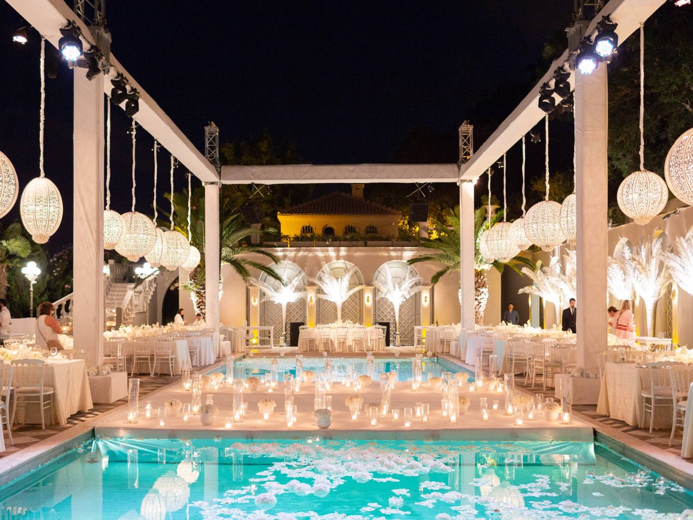 Nighttime and pool decor for white party at this Istanbul wedding weekend at Four Seasons Bosphorus | Photo by Allan Zepeda