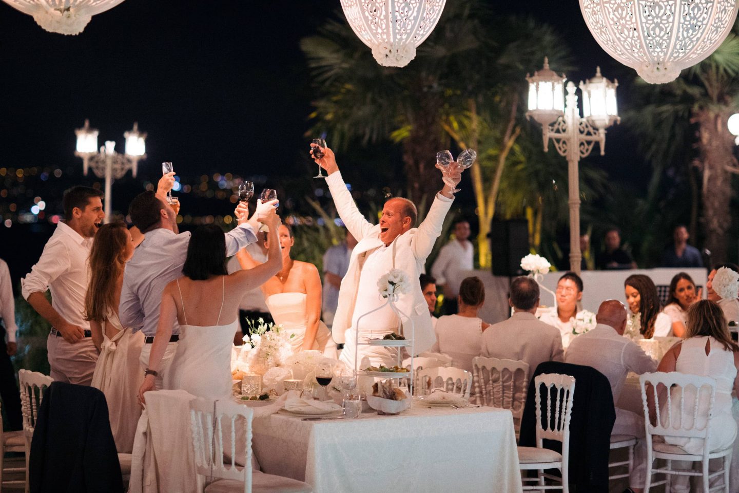Guests during white party decor at this Istanbul wedding weekend at Four Seasons Bosphorus | Photo by Allan Zepeda
