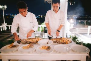 Chefs serving food at white party at this Istanbul wedding weekend at Four Seasons Bosphorus | Photo by Allan Zepeda