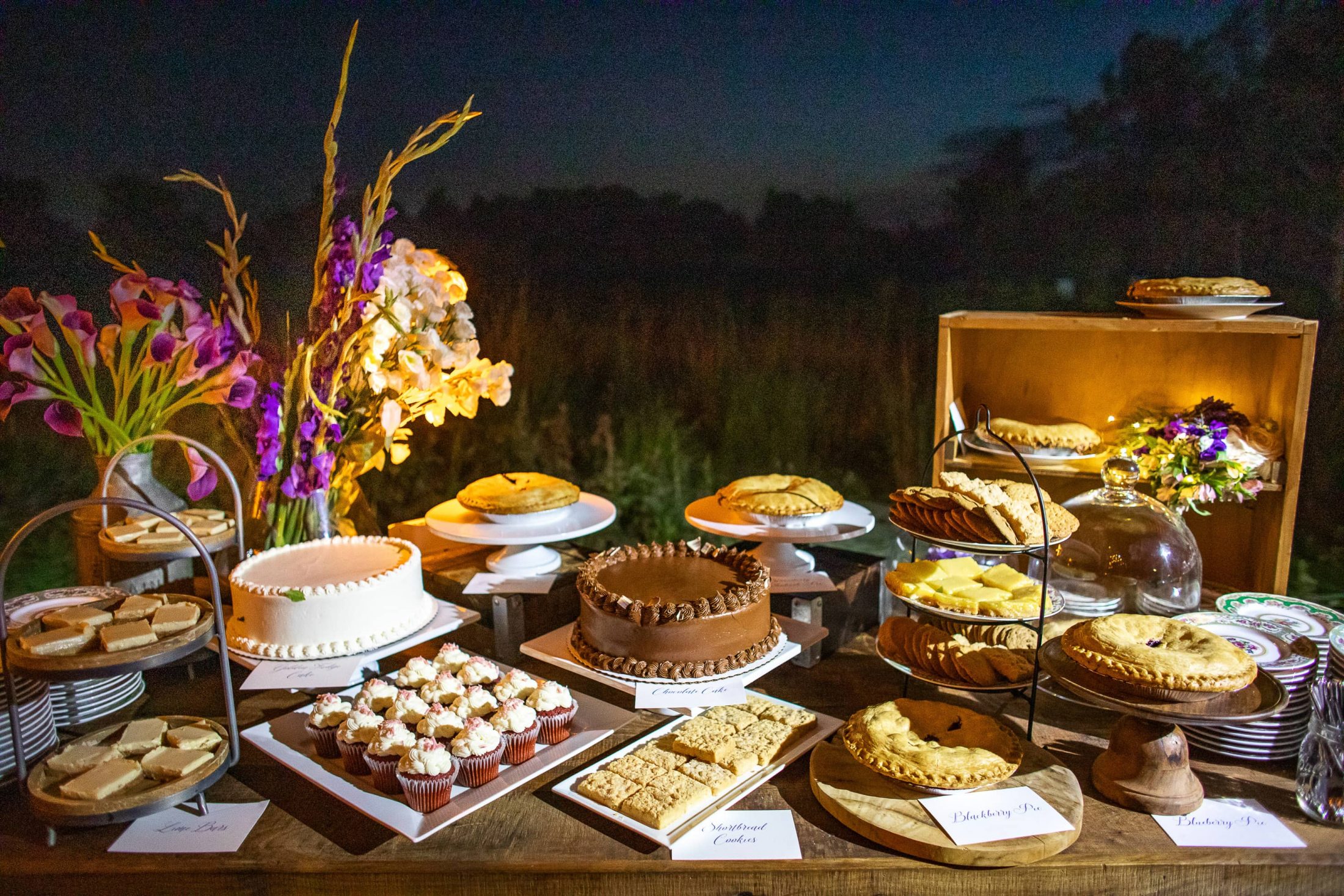 Dessert table of pies and cakes at this Hamptons wedding weekend held at The Parrish Museum | Photo by Roey Yohai Studio