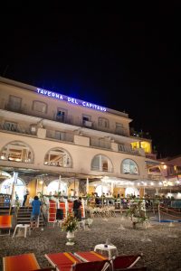Taverna del Capitano and beach at night at this Amalfi Coast wedding weekend held Lo Scoglio | Photo by Allan Zepeda