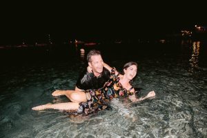 Bride and groom in the water at night at this Amalfi Coast wedding weekend held Lo Scoglio | Photo by Allan Zepeda