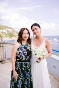 Bride and guest at this Amalfi Coast wedding weekend held Lo Scoglio | Photo by Allan Zepeda
