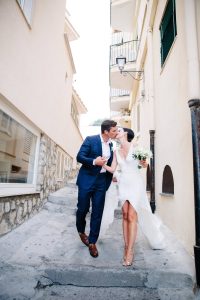 Bride and groom at this Amalfi Coast wedding weekend held Lo Scoglio | Photo by Allan Zepeda