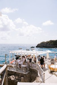Beach party near Conca del Sogno beach club at this Amalfi Coast wedding weekend held Lo Scoglio | Photo by Allan Zepeda