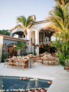 Outdoor reception by the pool at this Los Cabos wedding in Mexico | Photo by Allan Zepeda