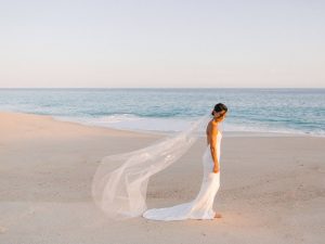Bride on the beach at this Los Cabos wedding in Mexico | Photo by Allan Zepeda