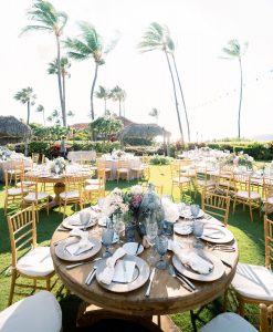 Outdoor reception under palm trees at Maui wedding at Four Seasons Resort Maui in Wailea, Hawaii | Photo by James x Schulze