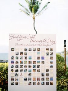 Peel away seating chart at Maui wedding at Four Seasons Resort Maui in Wailea, Hawaii | Photo by James x Schulze, text says "Find your Seat, Uncover a Story from the secret account of @lifeofoluanandjain