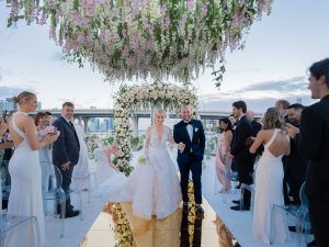 Newlyweds during ceremony at this Miami yacht wedding | Photo by Corbin Gurkin