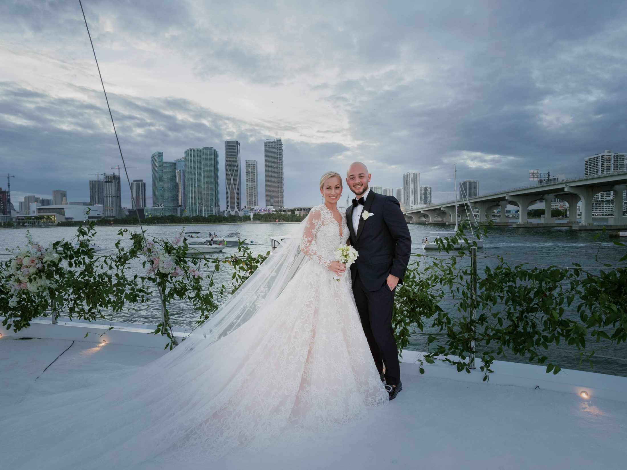 Bride and groom on the upper deck at this Miami yacht wedding | Photo by Corbin Gurkin