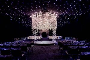 Chuppah made of hanging white orchids at this NYE wedding in New York City | Photo by Gruber Photo