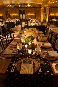 Black, white, and gold table decor for reception at this New York Public Library wedding | Photo by Genevieve de Manio