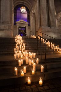 Candle-strewn stairway at this New York Public Library wedding | Photo by Genevieve de Manio