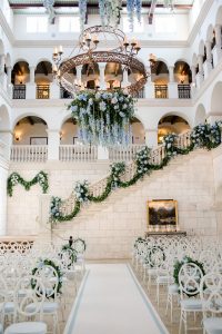 Cascading blue flowers at The Cloister ceremony at this Sea Island wedding weekend in Georgia, USA | Photo by Liz Banfield